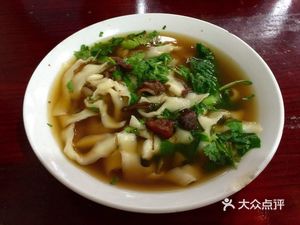 Bread Roll with Meat, Dumplings, and Daoxiao Noodles