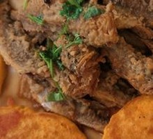 Pan-fried corn cakes with small fish stew