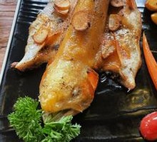 Pan-seared whole rainbow trout with garlic sauté
