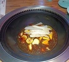 Stewed Pork Ribs and Chicken in Iron Pot