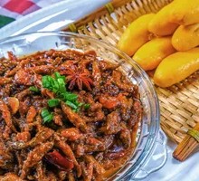 Pan-fried corn cakes with small fish stew