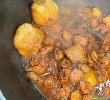 Stewed Rooster in Iron Pot