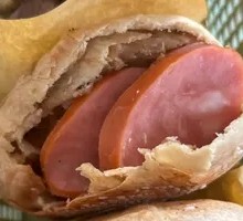 Braised flatbread with sausage