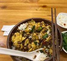 Grandmother's Vegetable Stir-Fry with Eggs in Wooden Bowl Rice