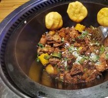 Stewed Rooster in Iron Pot