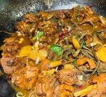 Stewed Rooster in Iron Pot