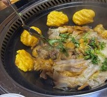 Stewed Rooster in Iron Pot