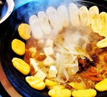 Stewed Rooster in Iron Pot