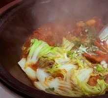 Stewed Pork Ribs and Chicken Feet in Iron Pot
