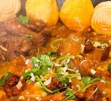 Stewed Rooster in Iron Pot