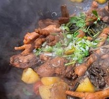 Stewed Rooster in Iron Pot