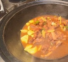 Stir-Fried Pork Ribs and Chicken Feet in Iron Pot