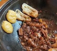 Stewed Pork Ribs and Chicken Feet in Iron Pot