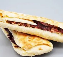 Fire-baked bread with ham