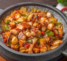 Grilled Octopus Tentacles on Stone Plate