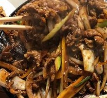 Beijing-style grilled lamb on a hot iron