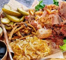 North German Roast Pork Knuckle with Mushroom Sauerkraut and Black Olives