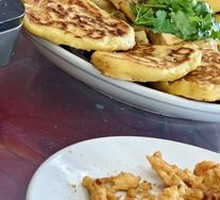 Pan-fried corn cakes with small fish stew