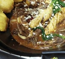 Stewed Rooster in Iron Pot