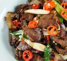 Stir-fried卤牛肉 with green garlic and chili