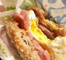 Braised flatbread with sausage and egg