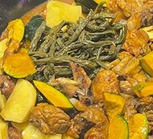 Stewed Rooster in Iron Pot