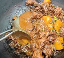 Stewed Rooster in Iron Pot