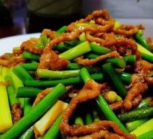 Stir-fried garlic shoots with pork