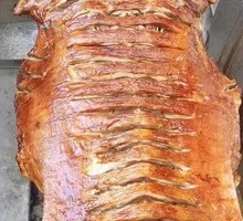 Whole Lamb Roasted Over Charcoal