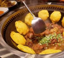 Stewed Rooster in Iron Pot
