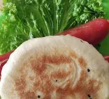 Braised flatbread with sausage