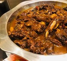 Stewed Rooster in Iron Pot