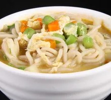 Hand-extruded noodle soup