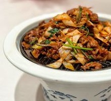 Beijing-style grilled lamb on a hot iron