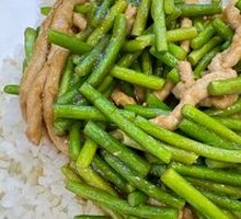 Stir-fried Pork with Garlic Greens over Rice