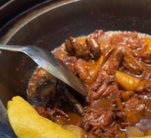 Stewed Rooster in Iron Pot