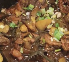 Stewed Rooster in Iron Pot