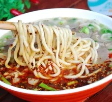 Hand-extruded noodle soup