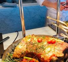 Tomahawk Steak Slow-Roasted Bone-In Ribeye with Grilled Sea Bass