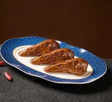 Spicy Duck Heads with Fire-Charred Sauce