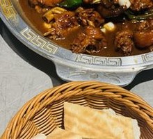 Stewed Rooster in Iron Pot