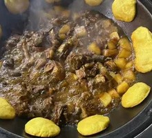 Stewed Pork Ribs and Chicken in Iron Pot