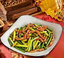 Stir-fried shredded pork with garlic shoots