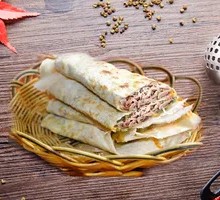 Freshly Cooked Warm Big Pancake Rolled with Lamb Offal