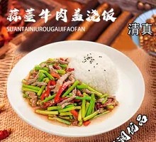 Stir-fried garlic shoots with pork over rice