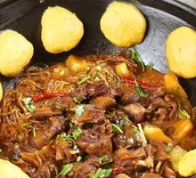 Stewed Rooster in Iron Pot