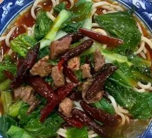 Hand-extruded noodle soup