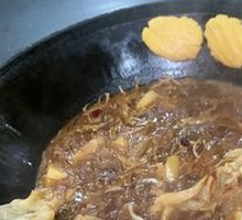 Stewed Rooster in Iron Pot