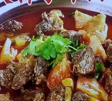 Stir-Fried Beef with Tomato over Open Flame