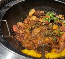 Stewed Rooster in Iron Pot